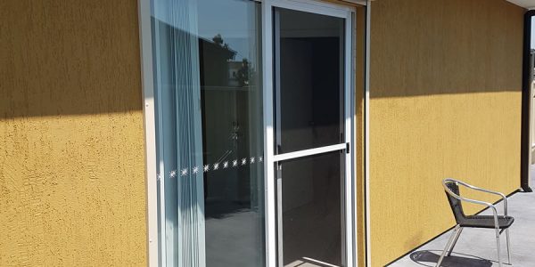 window roller shutter over glass door